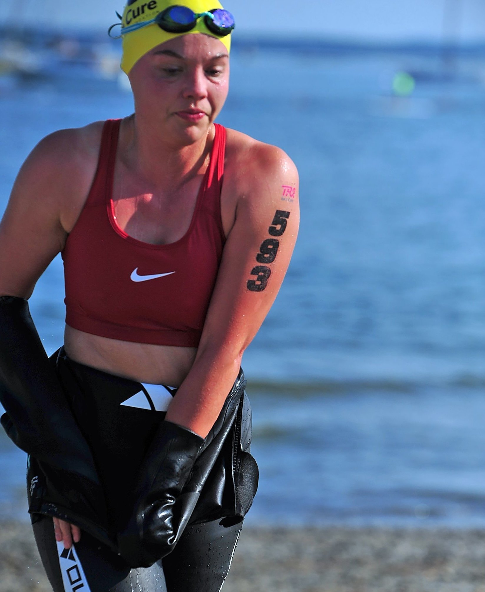 Helen leaving the water of the swim portion of a triathlon.