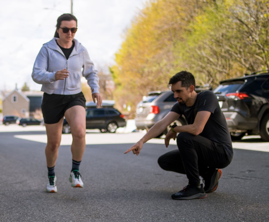 A Steady State physical therapist assessing a runner outdoors in Portland, Maine.