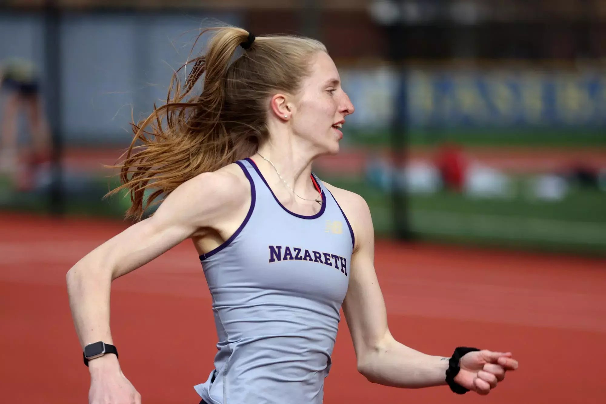 Dr. Brenna Johnson, PT, DPT, racing on the track for Nazareth University.