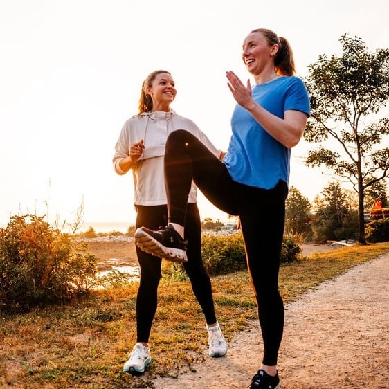 Dr. Helen Harrod Clark working with a runner on running drills at the Eastern Prom in Portland, Maine.