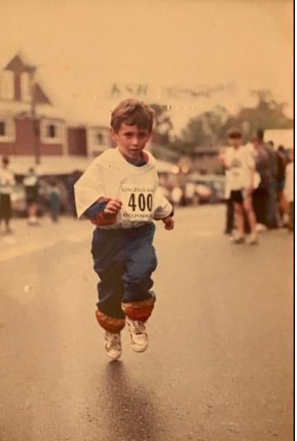 Kelton running a 1 mile road race in Kingfield Maine in 1997.