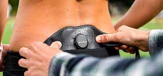 A runner wearing a black Runeasi gait analysis belt.