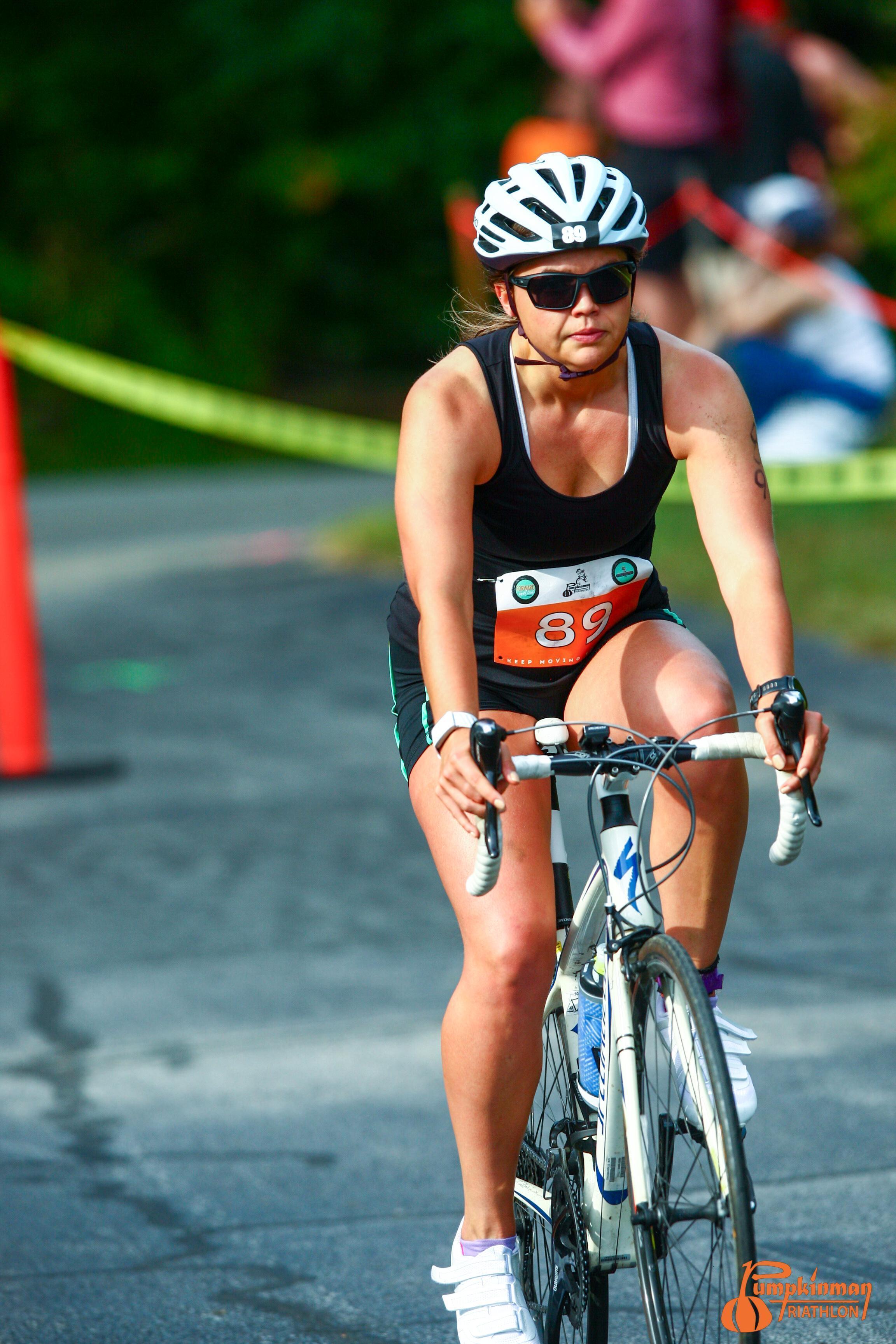 Helen cycling during a triathlon.