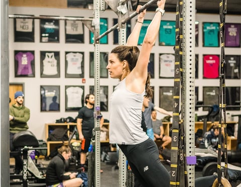 Dr. Ashten doing a kip swing at Misfit CrossFit in Portland, Maine.