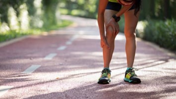 A runner having to stop running because of shin splints pain.