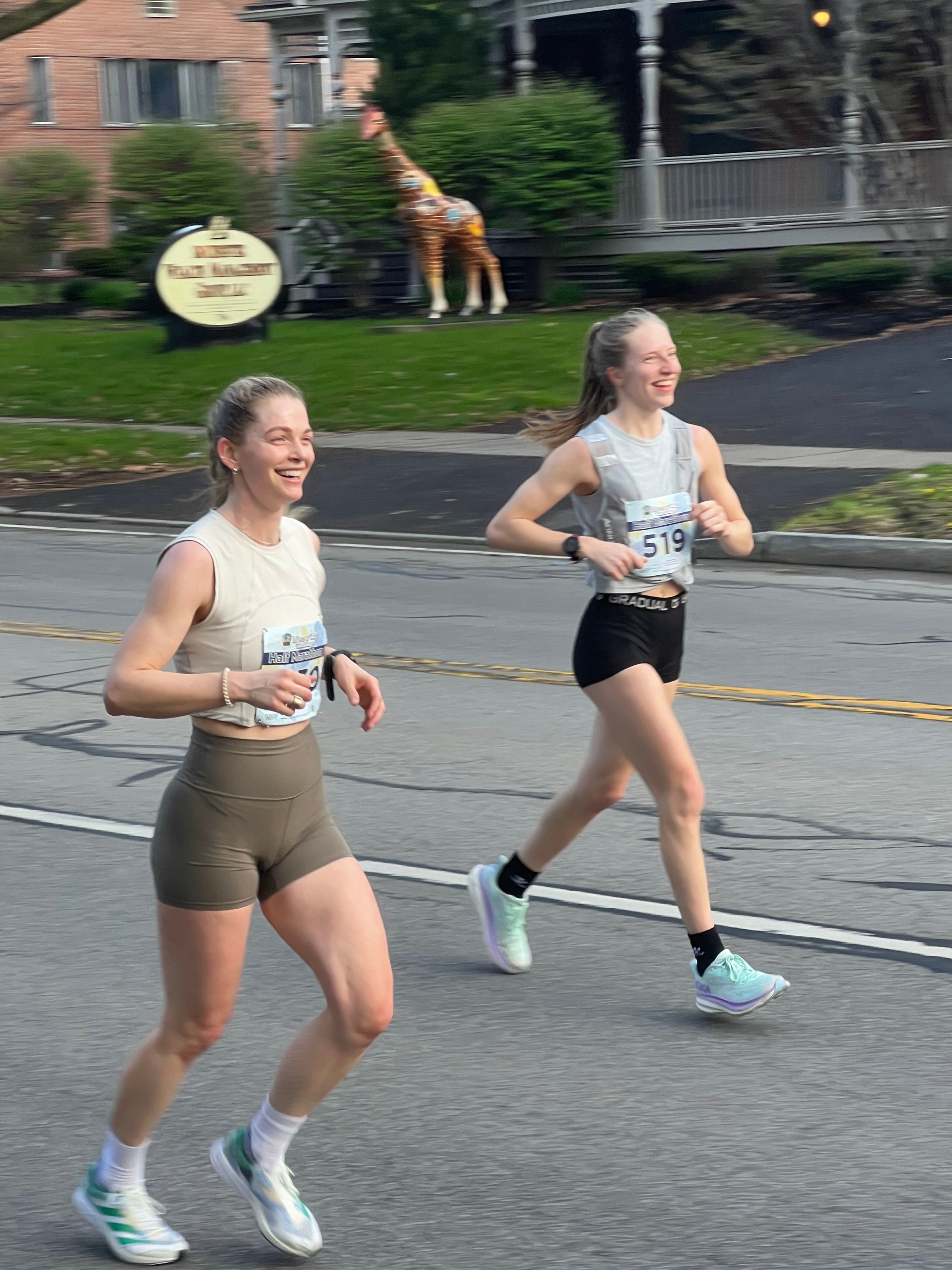 Brenna running a half marathon with a friend.