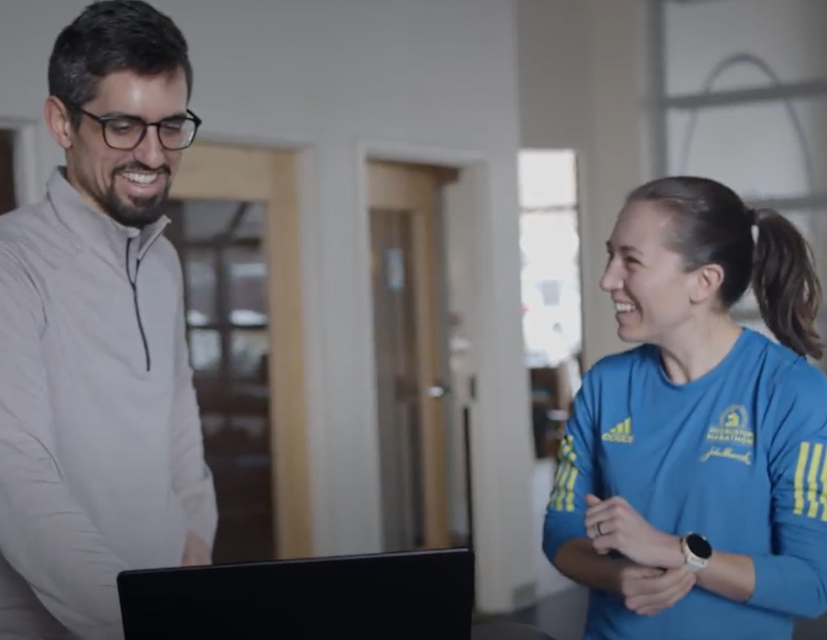 A Portland Maine Physical Therapist educating a runner about their running injury.