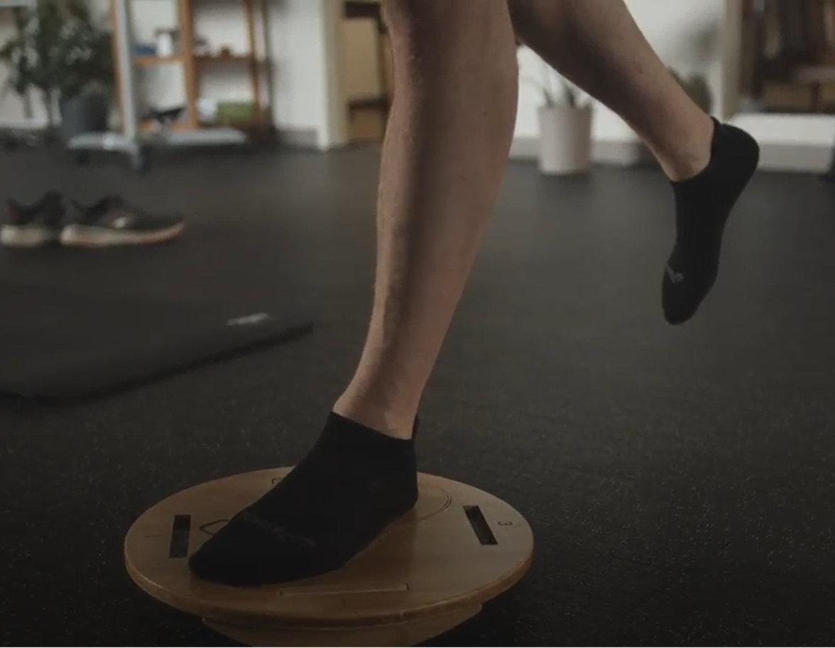 A Portland Maine runner balancing on a Moboboard.