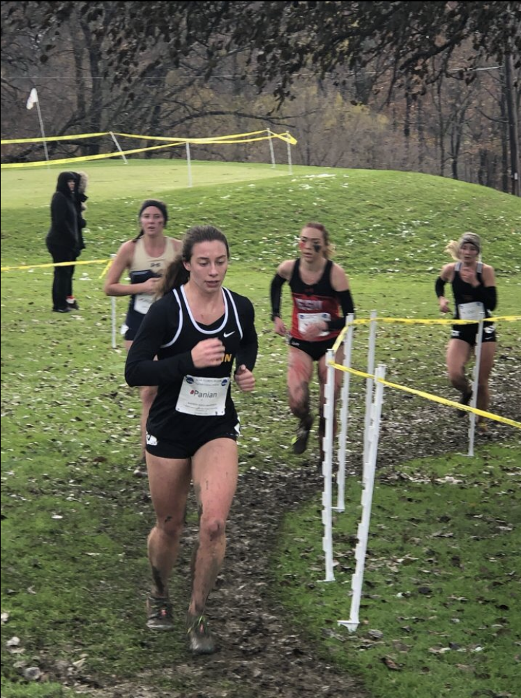 Dr. Victoria Panian running a cross country race.