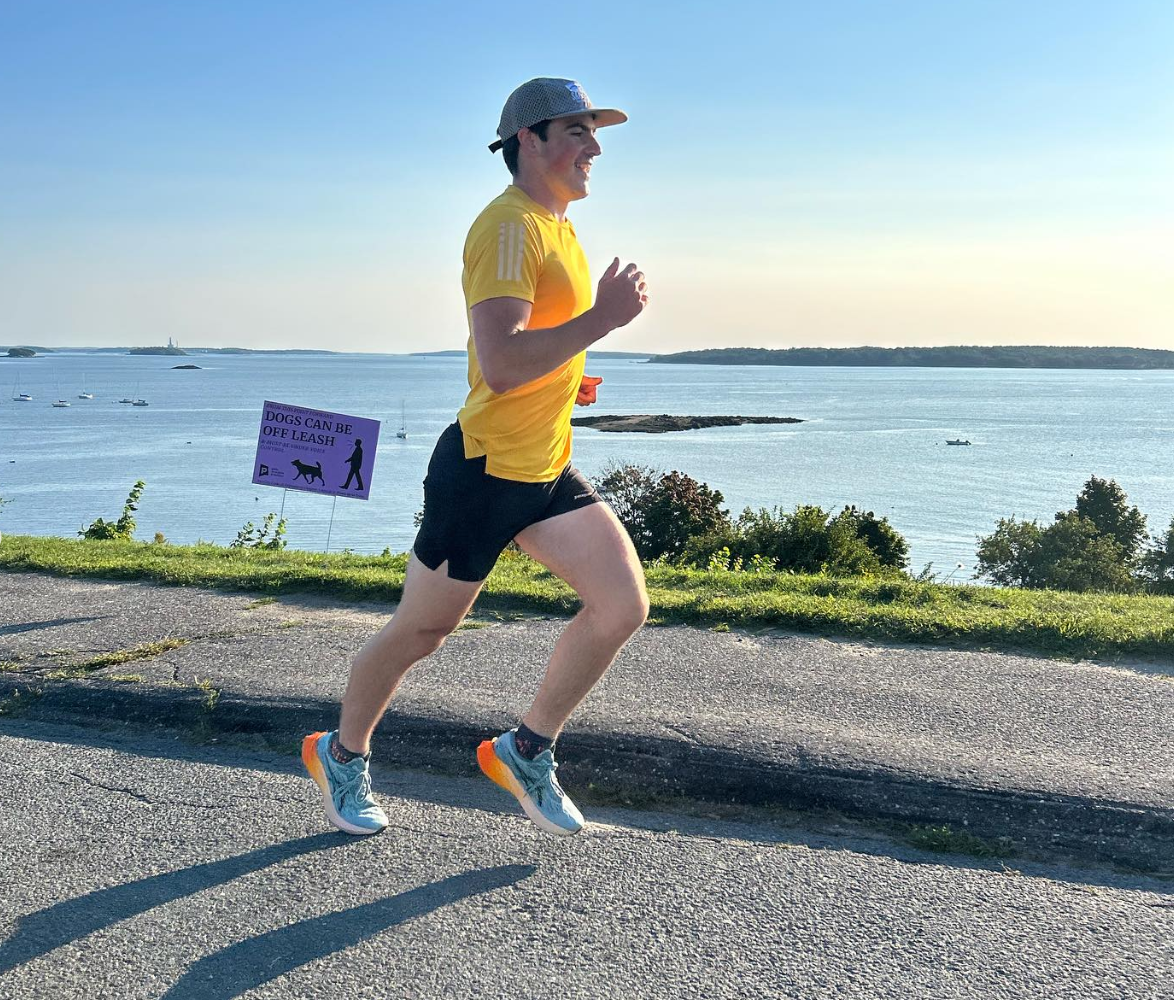 A runner running uphill in the East End in Portland Maine.